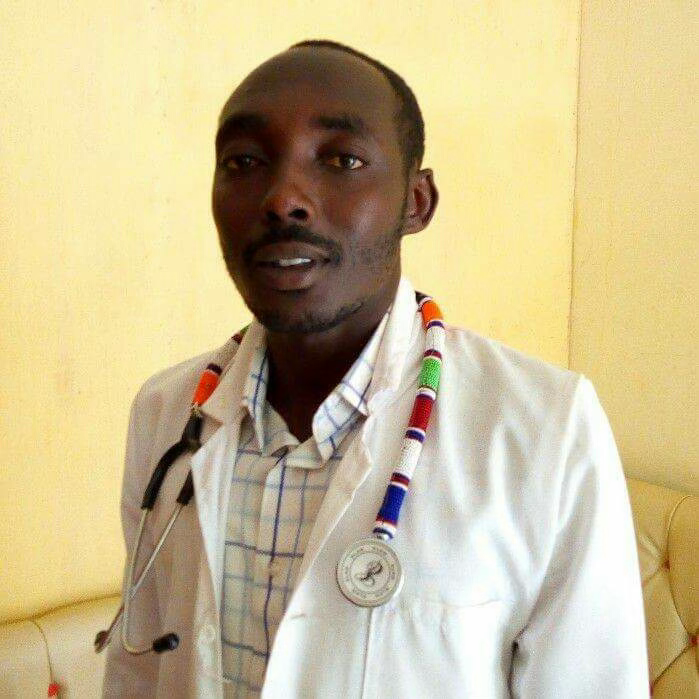 Dr. Daniel ole Koitatoi wearing his beaded stethoscope
