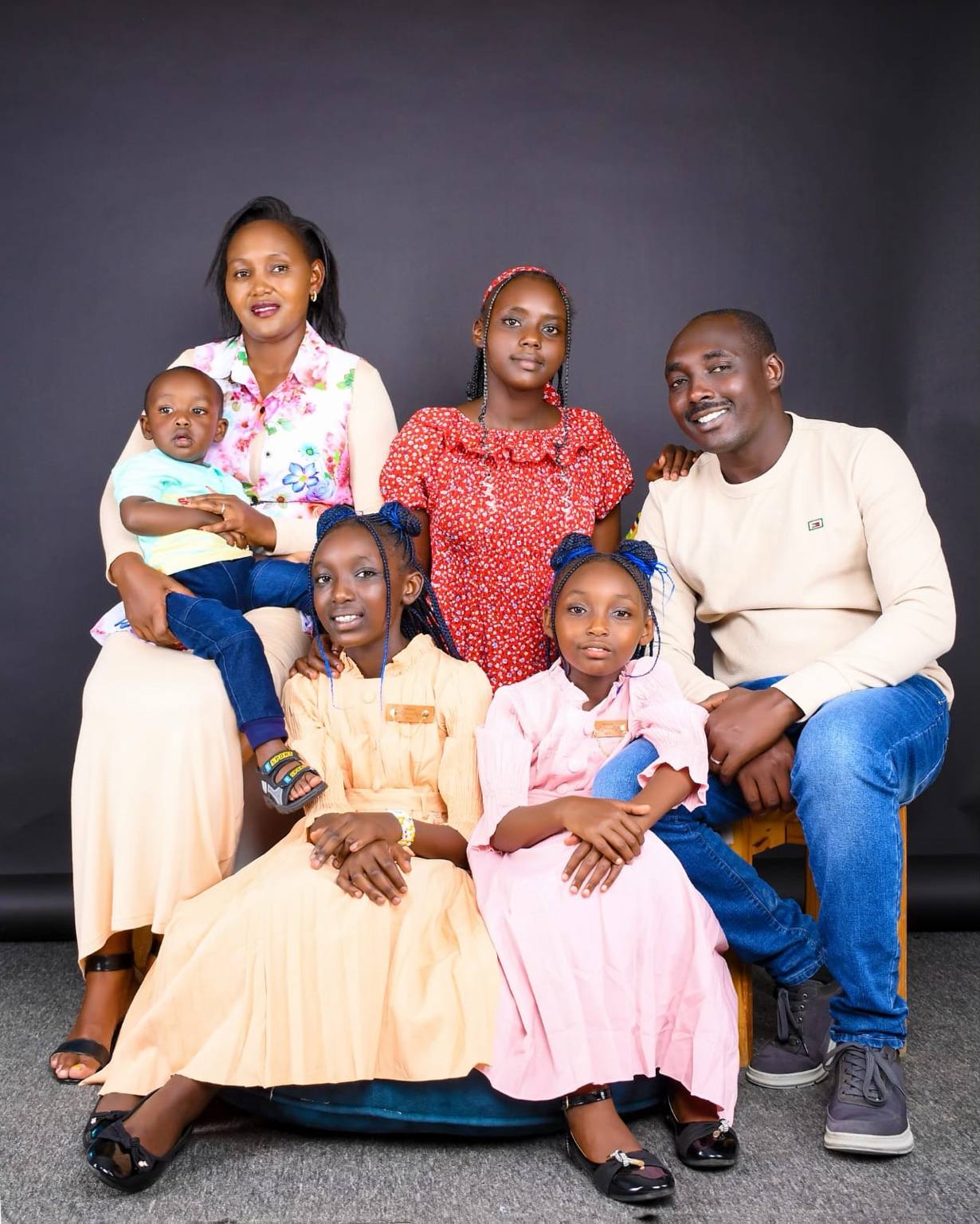 Dr. Daniel ole Koitatoi with his wife and children